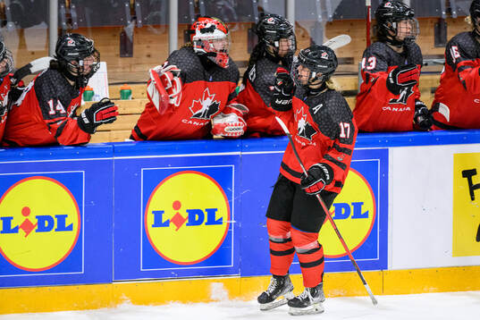 Alex Law of Canada celebrates