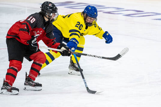 Eloise Caron of Canada and Emma Goding of Sweden