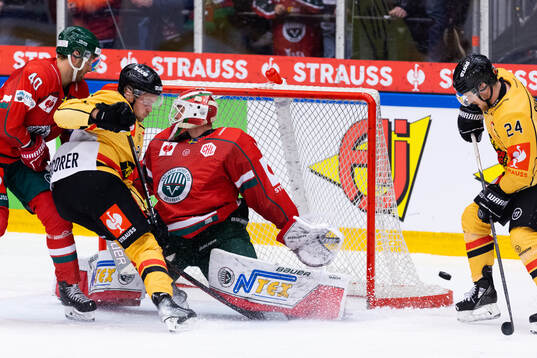 Juhani Tyrväinen of Luleå skates into goalkeeper Lars