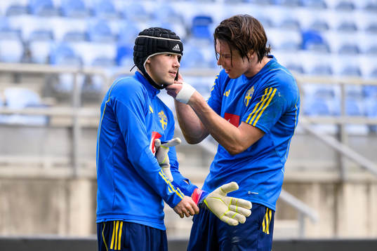 Jacob Ondrejka and goalkeeper Jacob Widell Zetterström of