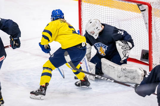 Mira Jungåker of Sweden against goaltender Kerttu