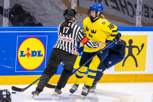 Hilda Svensson of Sweden collides with a referee