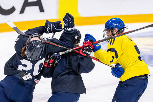 Ella Hellman of Sweden in action against Sofia Kari and