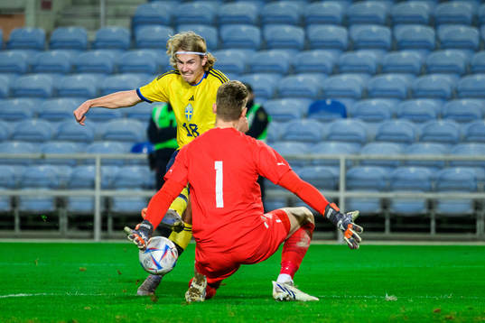 Sebastian Nanasi of Sweden and goalkeeper Fredrik Schram of