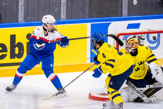 Nela Lopusanova of Slovakia scores 1-1 against goaltender