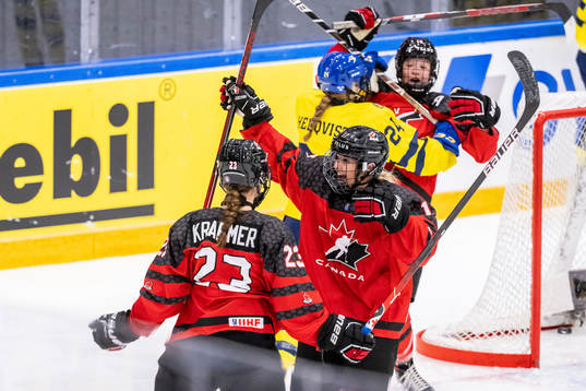 Caitlin Kraemer and Alex Law of Canada celebrate