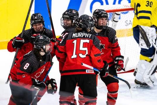 Players of Canada celebrate scoring 4-0
