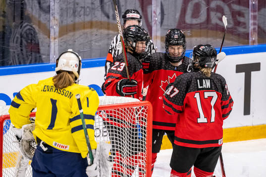 Caitlin Kraemer and Jocelyn Amos of Canada celebrate the