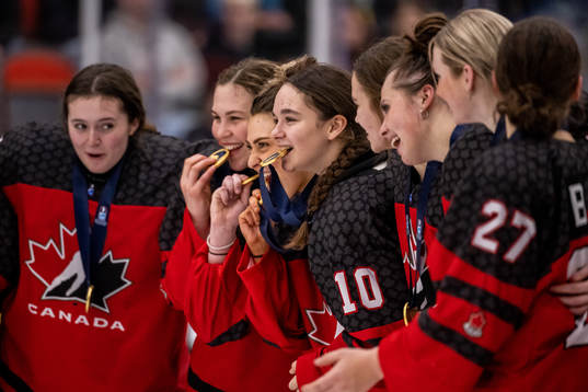 Eloise Caron of Canada celebrate with the gold medal
