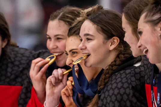 Eloise Caron of Canada celebrate with the gold medal