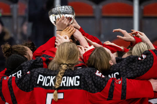 Players of Canada celebrate with the trophy