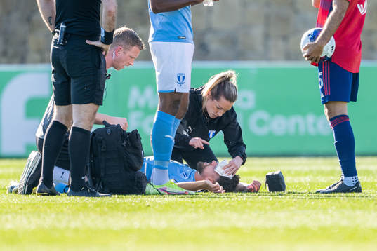 Doctor Amanda Lahti attends to Moustafa Zeidan of Malmö FF