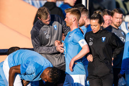Physiotherapist Jesper Robertsson attends to Anders