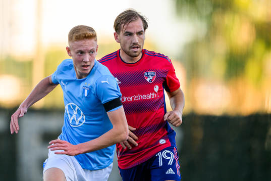 Hugo Larsson of Malmö FF and Pomykal Paxton of Dallas