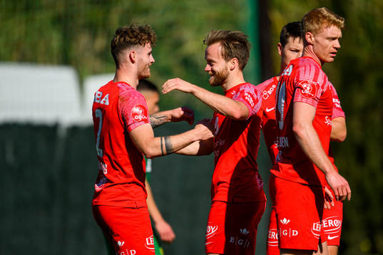 Ole Didrik Blomberg of Brann celebartes with his teammates