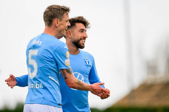 Søren Rieks celebrates with Moustafa Zeidan of Malmö FF