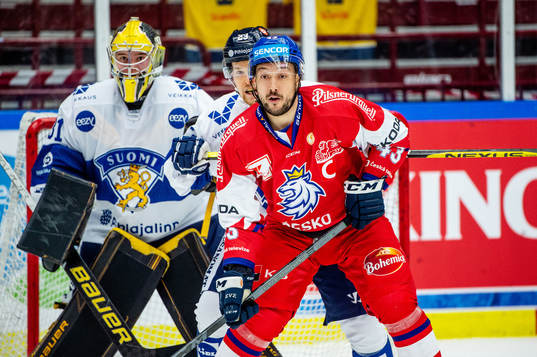 Julius Mattila and goaltender Juha Jatkola of Finland and