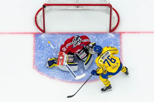 Goaltender Sandro Aeschlimann of Switzerland and Jonathan