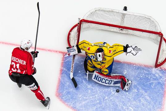 Luca Hischier of Switzerland and goalkeeper Jhonas Enroth
