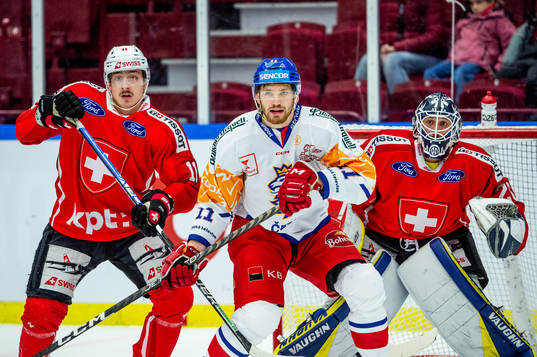 Adam Musil of Czech Republic and Justin Sigrist and