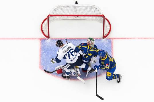 Jere Sallinen of Finland, goaltender Lars Johansson and