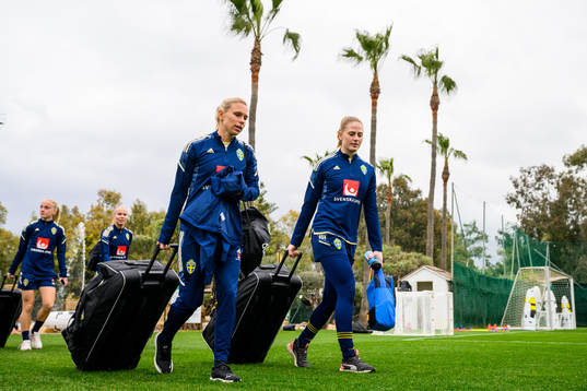 Jonna Andersson and goalkeeper Tove Enblom of the Swedish