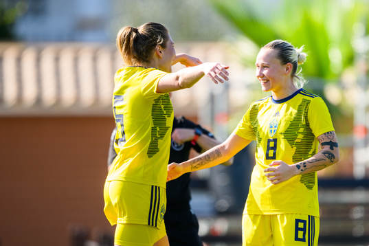 Fanny Andersson celebrates with Marika Bergman Lundin of
