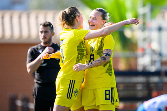 Fanny Andersson celebrates with Marika Bergman Lundin of