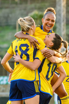 Johanna Rytting Kaneryd is hugged by Fridolina Rolfö and