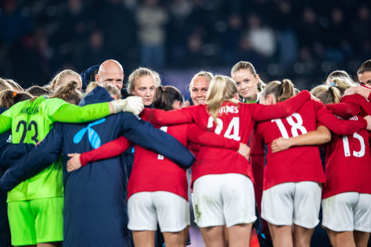 Maria Thorisdottir and goalkeeper Guro Pettersen of Norway