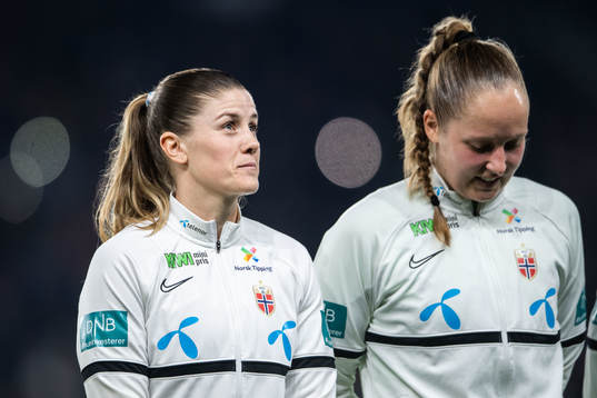 Maren Mjelde and goalkeeper Aurora Mikalsen of Norway