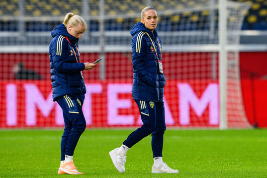 Anna Sandberg and Hanna Lundkvist of Sweden walks the pitch