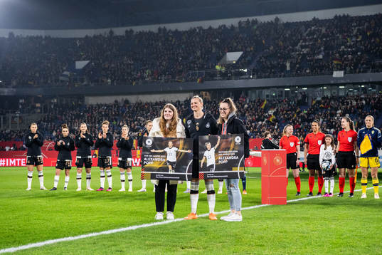 Alexandra Popp of Germany receives an award