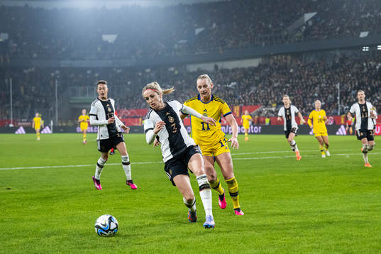 Kathrin Hendrich of Germany and Stina Blackstenius of Sweden