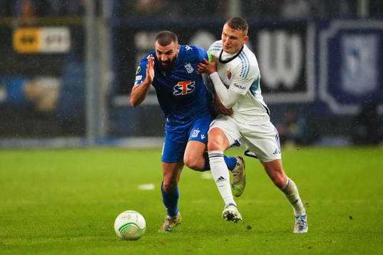Mikael Ishak of Lech Poznan and Piotr Johansson of