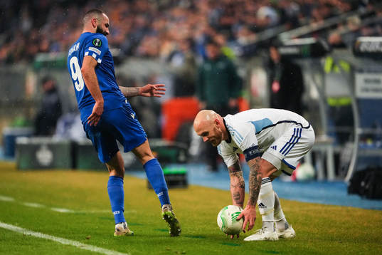 Mikael Ishak of Lech Poznan and Magnus Eriksson of
