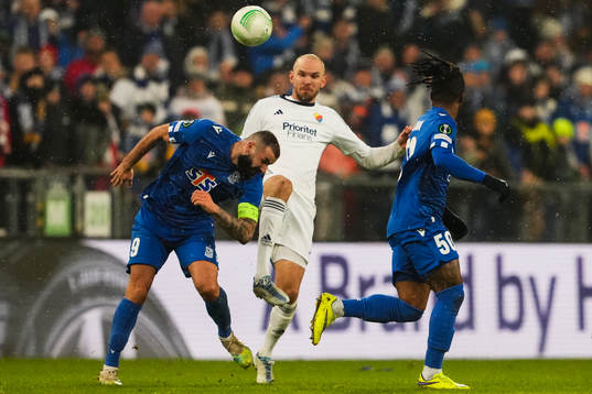 Mikael Ishak of Lech Poznan and Marcus Danielson of