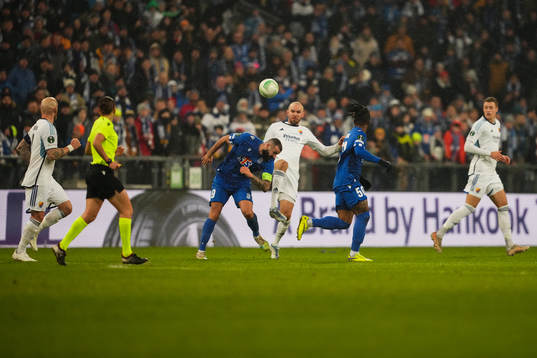 Mikael Ishak of Lech Poznan and Marcus Danielson of