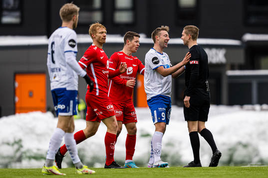 Sondre Liseth of Haugesund and Espen Andreas Eskås, referee