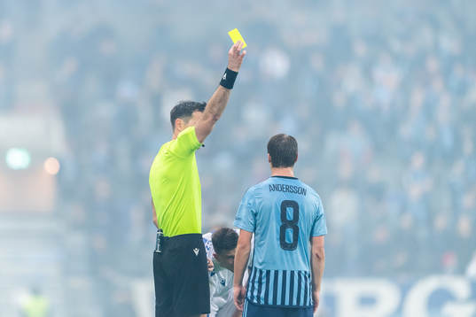 Elias Andersson of Djurgården is given a yellow card by