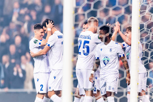 Filip Marchwinski of Lech Poznan celebrate with Joel Pereira