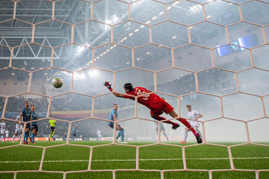 Michal Skoras of Lech Poznan shoots to score past