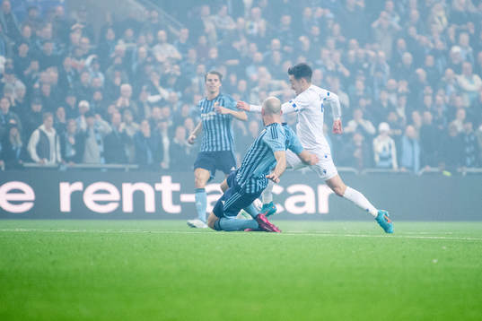 of Djurgården Marcus Danielson and Michal Skoras of Lech