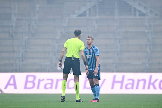 Rasmus Schuller of Djurgården and referee Duje Strukan