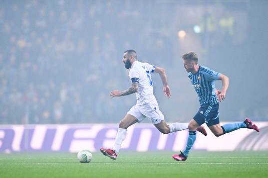 Mikael Ishak of Lech Poznan and Rasmus Schuller of