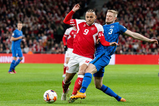 Martin Braithwaite of Denmark and Richard Jensen of Finland