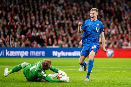 Oliver Antman of Finland against goalkeeper Kasper