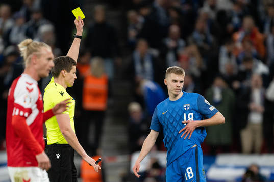 Oliver Antman of Finland receives a yellow card