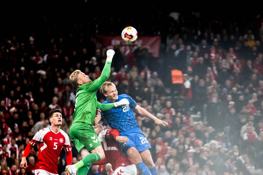 Goalkeeper Kasper Schmeichel of Denmark and Joel Pohjanpalo
