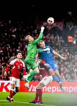 Goalkeeper Kasper Schmeichel of Denmark and Joel Pohjanpalo